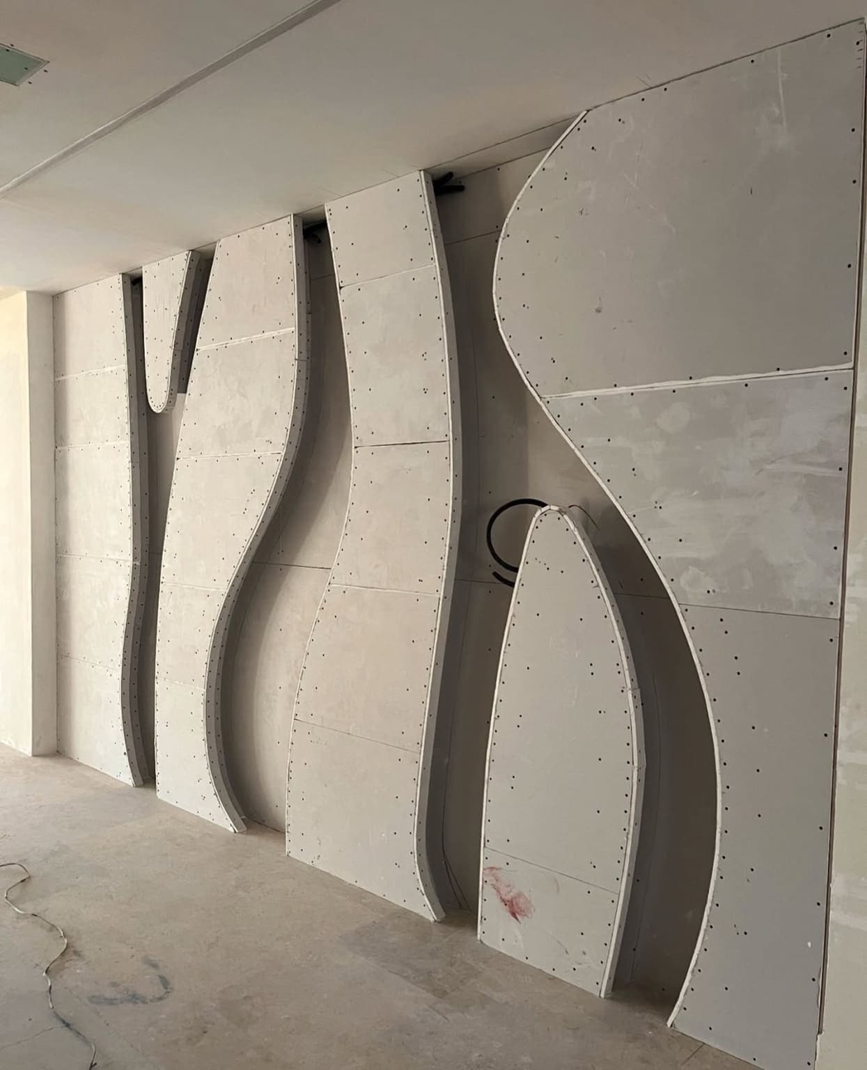 Specialized moisture-resistant gypsum board installation in bathroom with proper vapor barriers