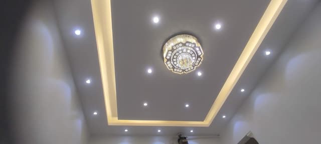 Decorative gypsum board installation featuring textured finish and integrated architectural details