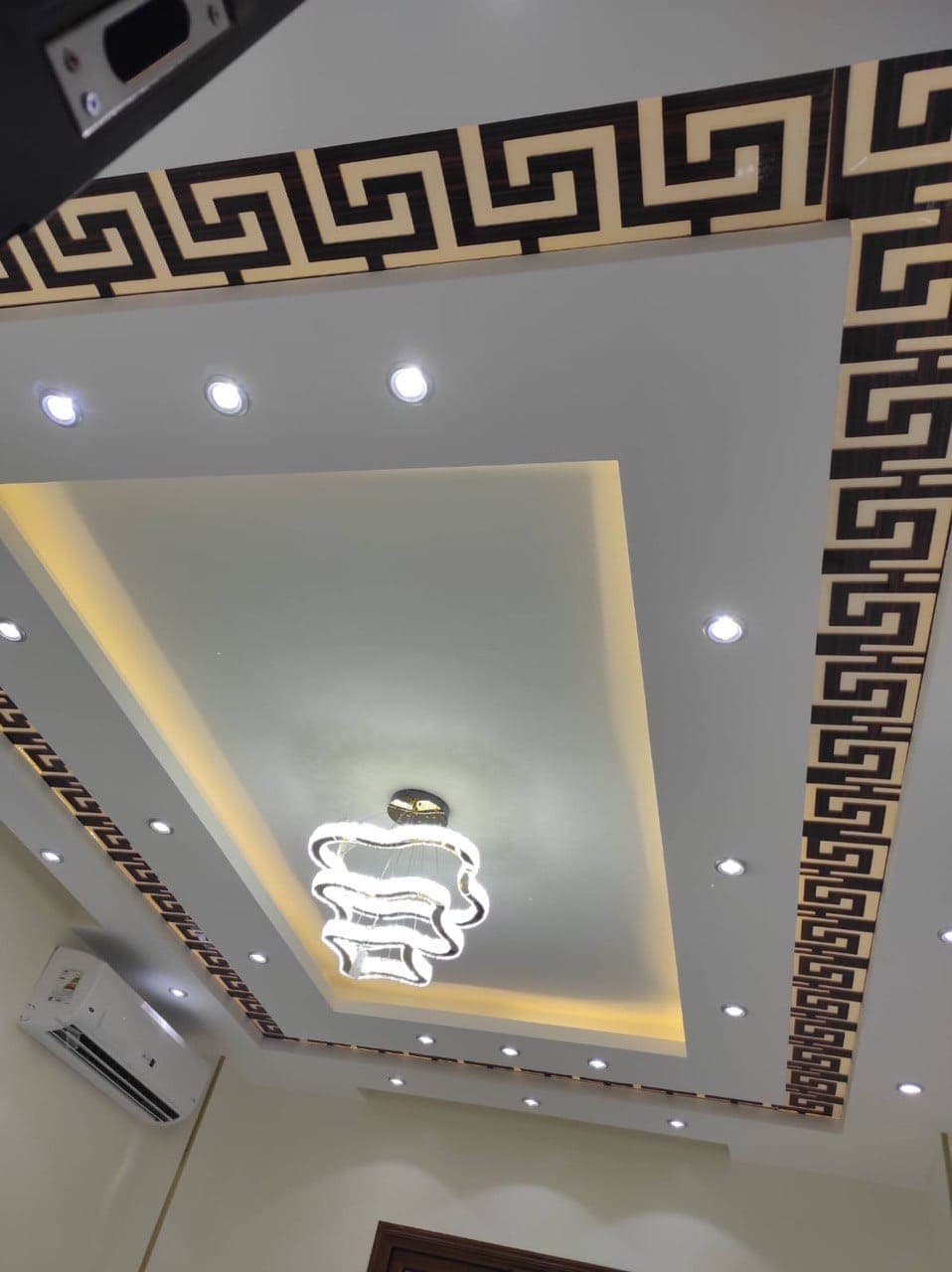 Custom gypsum board construction for walk-in closet with integrated shelving framework