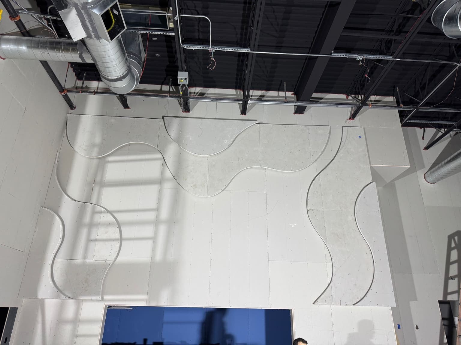 Gypsum board installation with specialized textured finish and decorative surface treatment