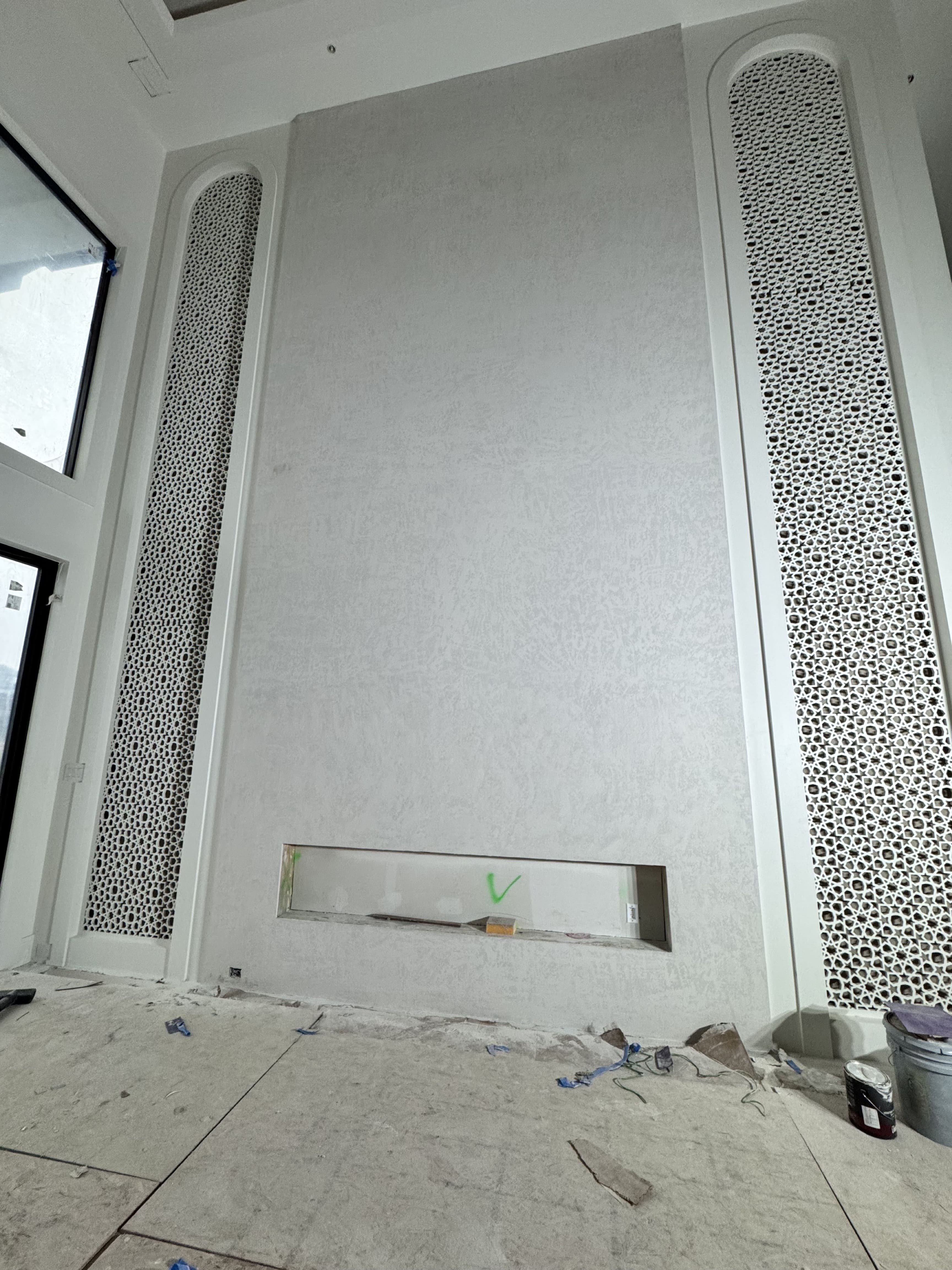 Classic gypsum board wall installation with traditional finishing and fireplace integration