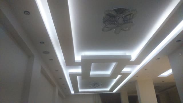 Gypsum board installation with integrated built-in shelving framework and precise measurements